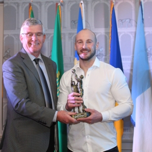 Peter-Foy-receiving-an-award-in-recognition-of-his-long-inter-County-service-from-Tom-Mulligan-Chairman-Longford-Slashers-G.F.C.