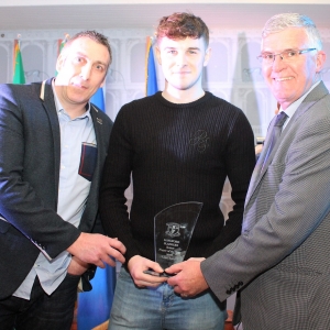 Senior-Player-of-the-year-Liam-Barry-receiving-his-award-from-Gordon-Hourican-Senior-Selector-and-Tom-Mulligan-Chairman-Longford-Slashers-G.F.C.