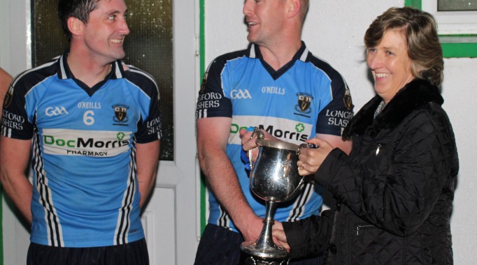 Joint Captains, Diarmad McRory and Thomas O'Rourke being presented with the ACL div.3 trophy by Brid McGoldrick,of Longford County Board GAA.