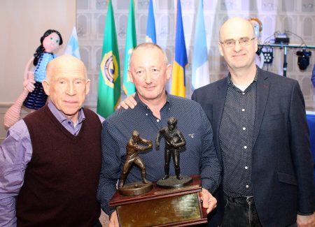 Jerry Sheehan being presented with the Liam Hastings Award, for his outstanding service to the club, by Donal Brady, Club President and Mark Connellan.