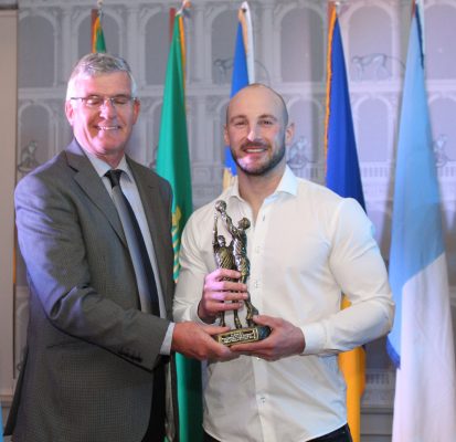 Peter Foy, receiving an award in recognition of his long inter County service from Tom Mulligan, Chairman, Longford Slashers G.F.C.