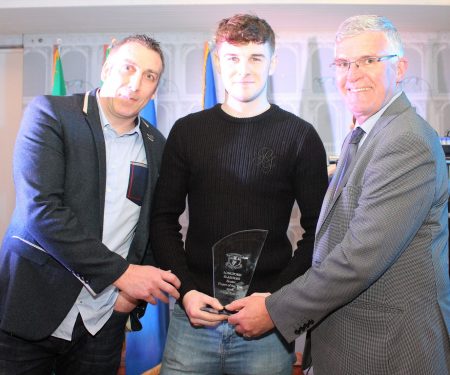 Senior Player of the year , Liam Barry, receiving his award from Gordon Hourican, Senior Selector, and Tom Mulligan Chairman, Longford Slashers G.F.C.